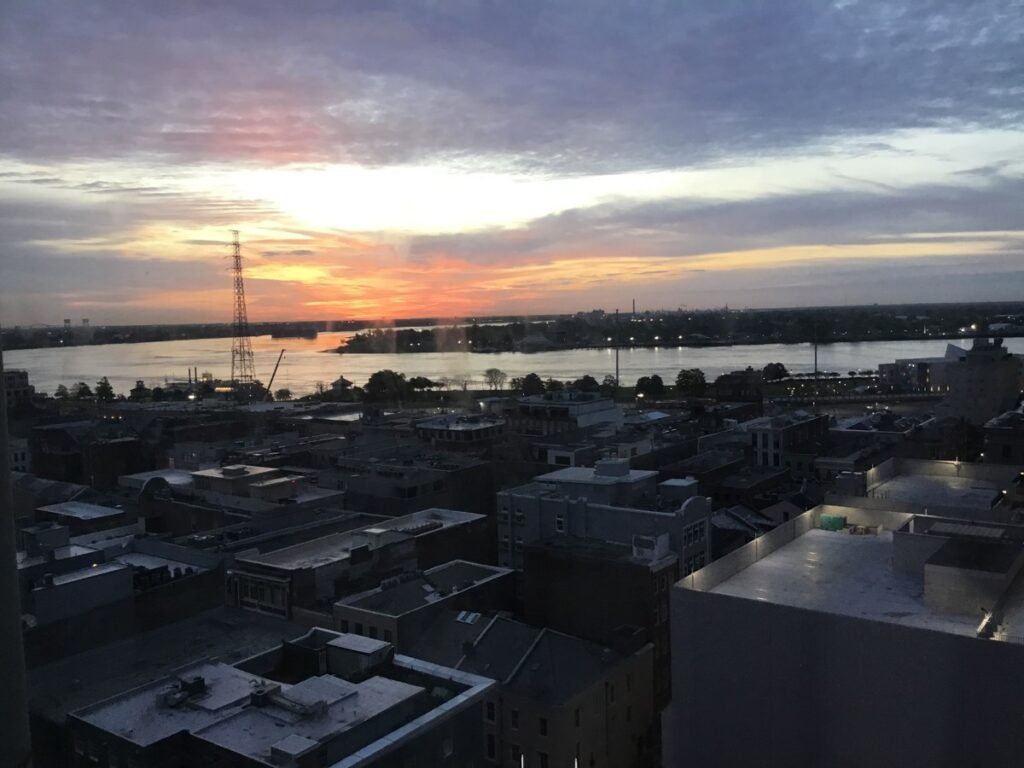View across the French Quarter rooftops toward the Mississippi River in New Orleans